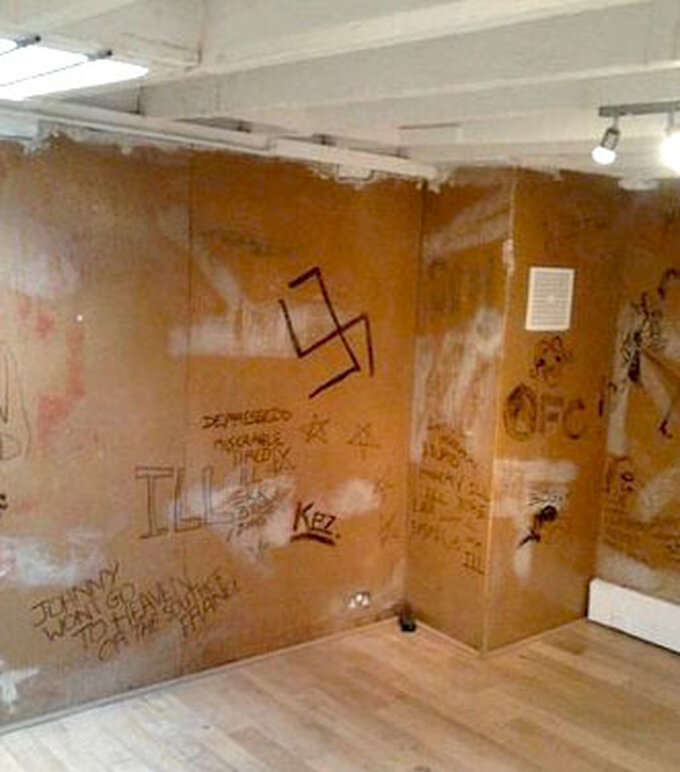 Graffitied walls of the Sex Pistol's rehearsal room
