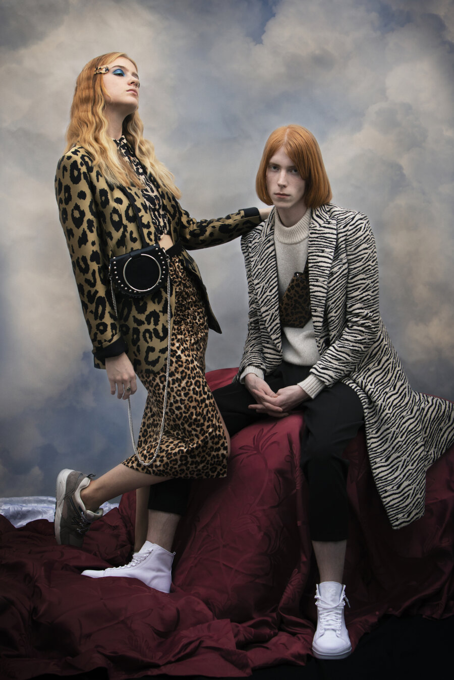 Two models in front a cloud background