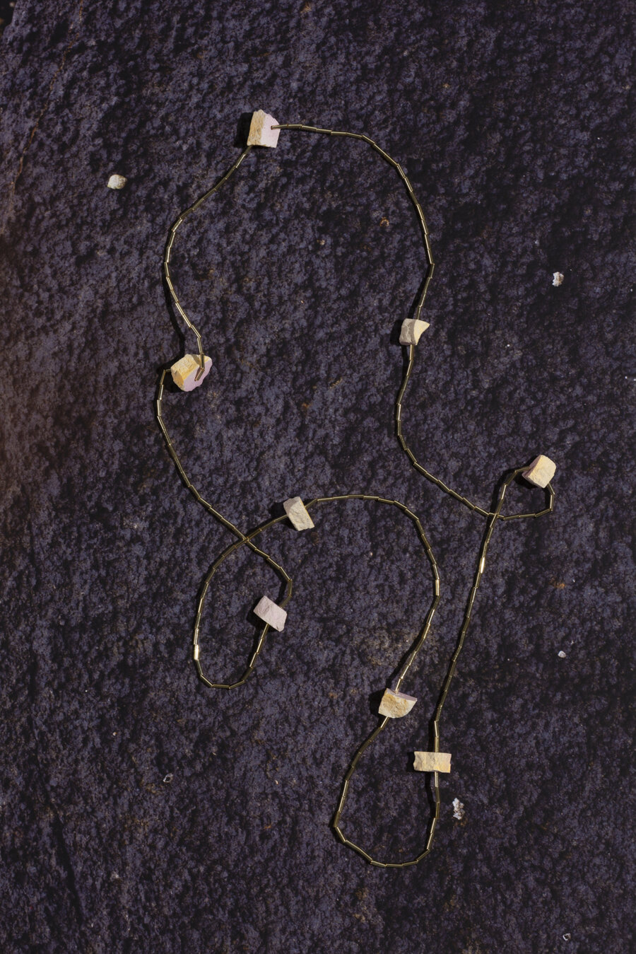 Print of rock scape with Kate Trouw necklace on top