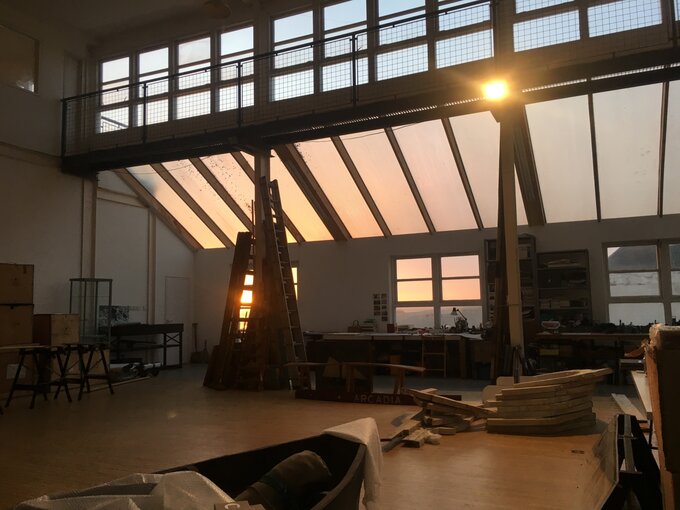 Interior of Kate Trouw's studio with sun setting in background