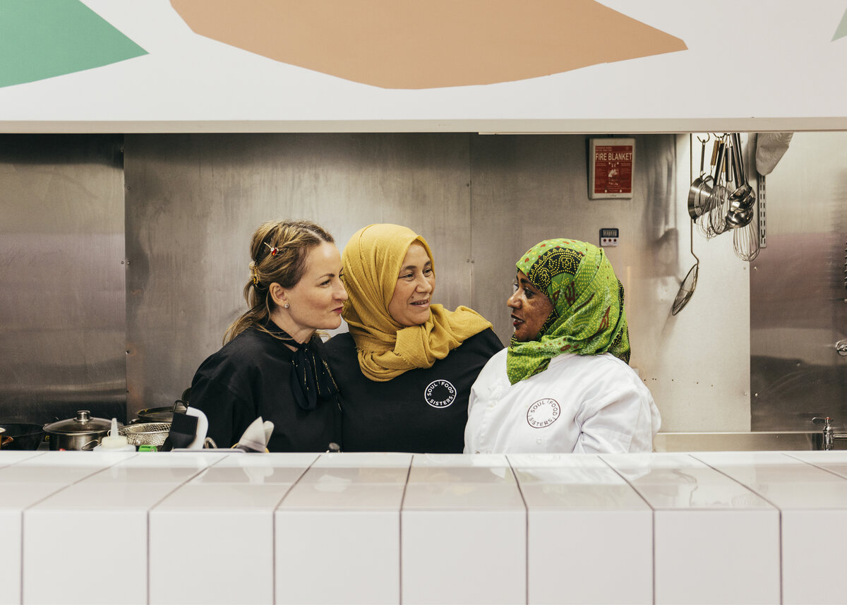 Three women talking to each other