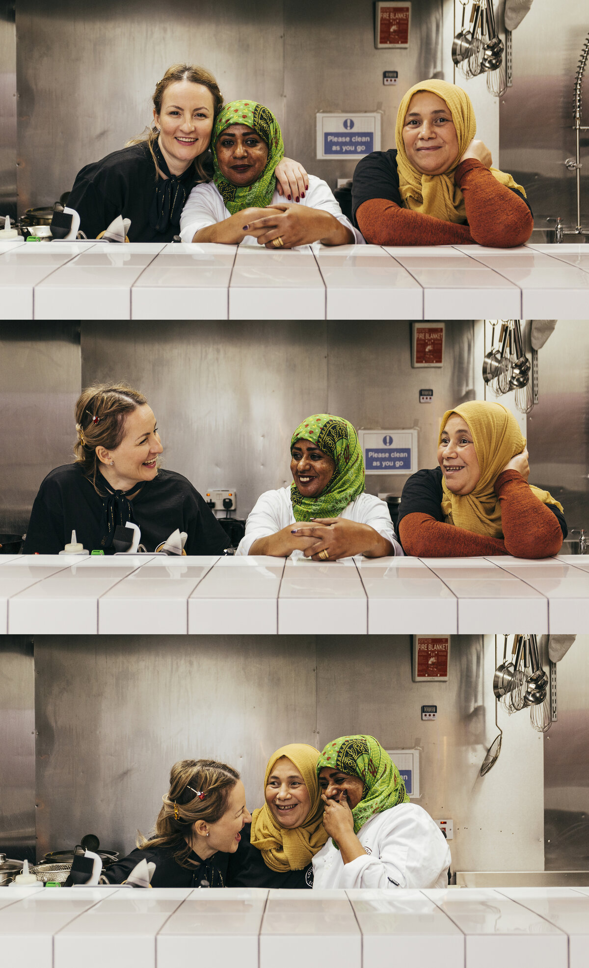 Three women of different nationalities talking and laughing.